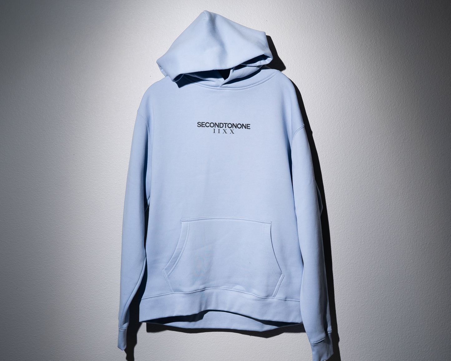 a powder blue midweight hoodie with the second to none classic logo centered on the front chest