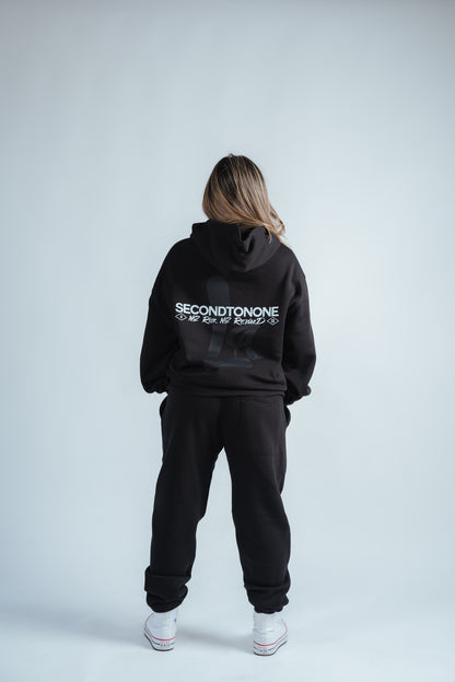 back photo of the joggers and hoodie combo worn by female model