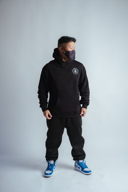 male model showing the front of the no risk relaxed hoodie