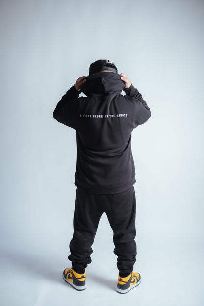 male model showing the victory relaxed hoodie back graphic