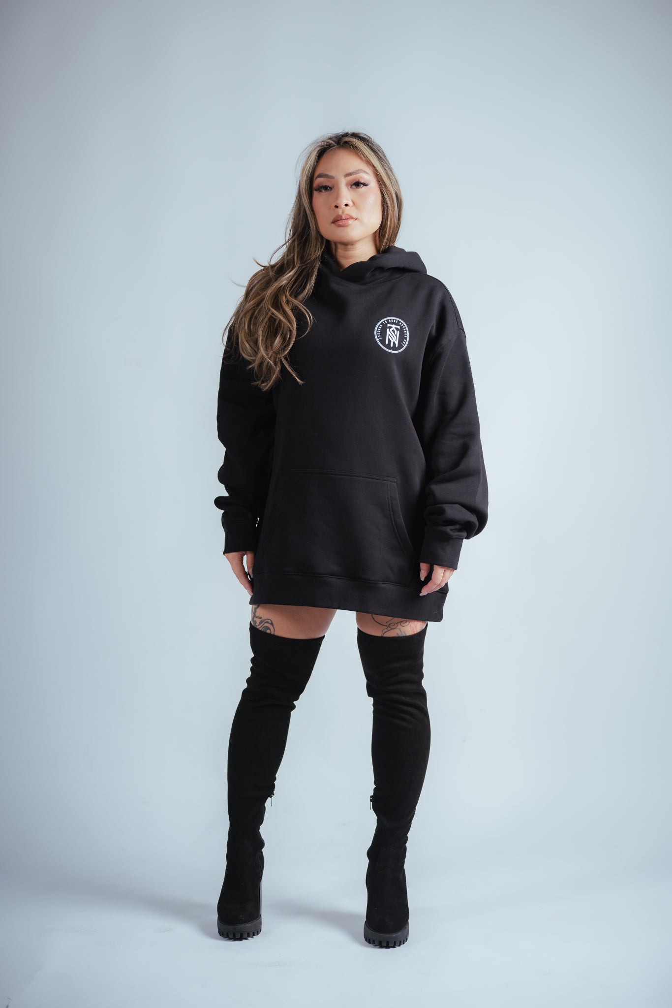 female model wearing the second to none victory hoodie in size large