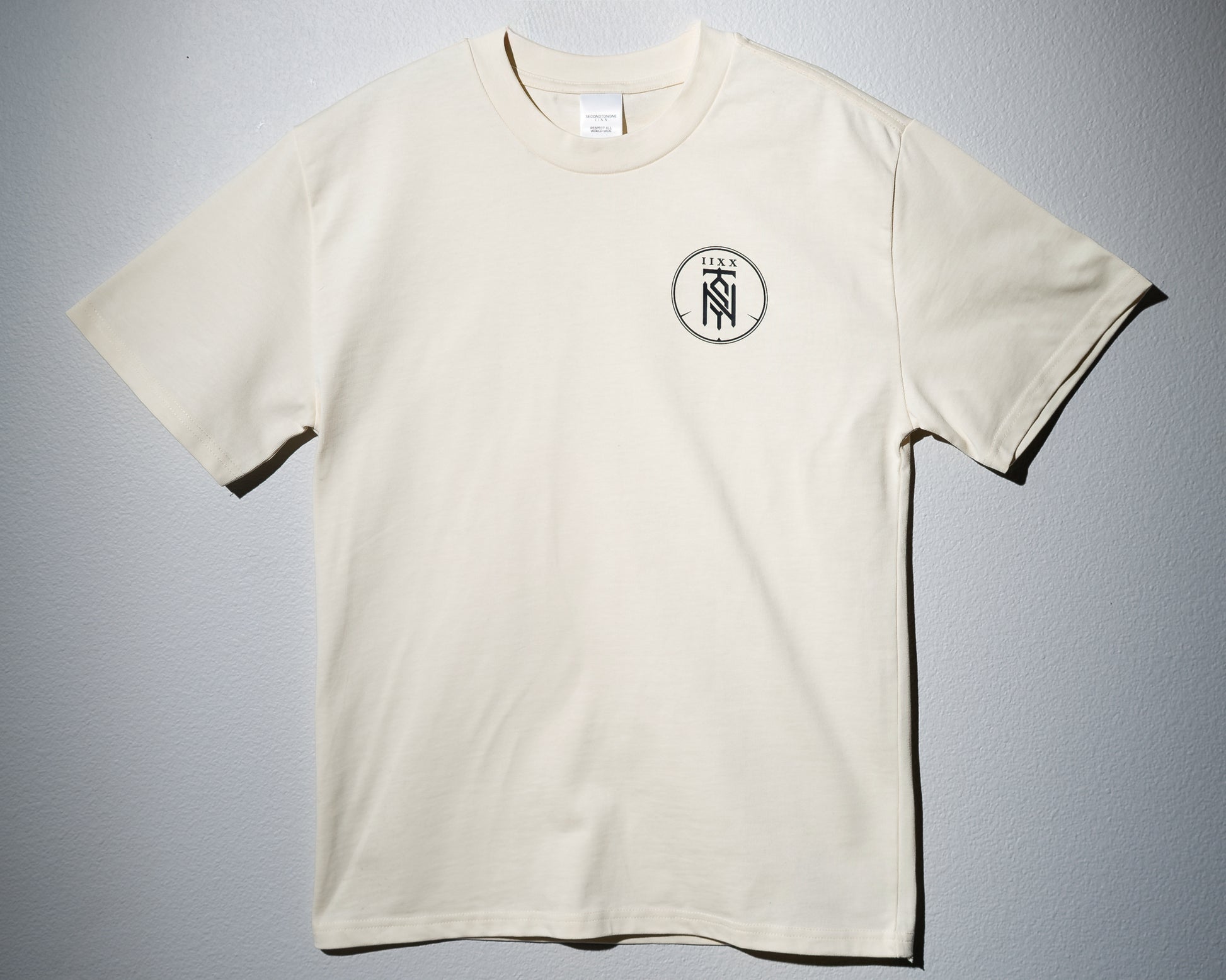 a tan heavyweight tee with the second to none monogram printed on the left chest